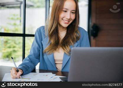 Asian woman working with laptop computer she analyst financial advisor preparing statistic report studying documents, Businesswoman audit financial charts and graphs