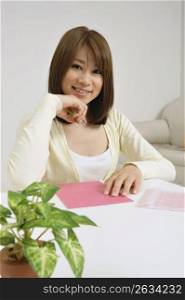 Asian woman writing