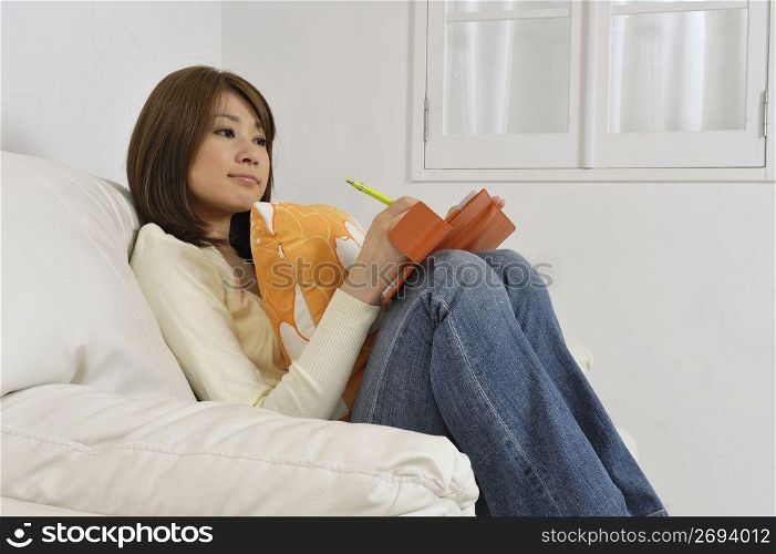Asian woman writing