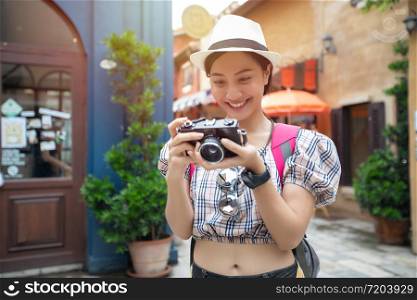 Asian women backpacks walking together and happy are taking photo and selfie Relax time on holiday concept travel