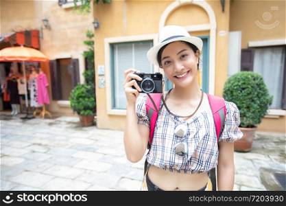 Asian women backpacks walking together and happy are taking photo and selfie Relax time on holiday concept travel