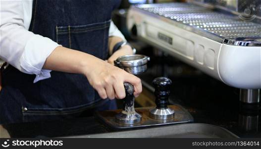 Asian women Barista smiling and using coffee machine in coffee shop counter - Working woman small business owner food and drink cafe concept