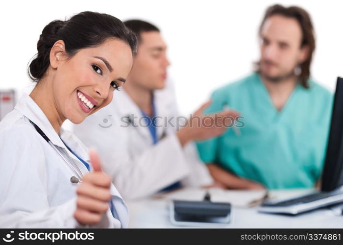 Asian women doctor show ok sign, two other team mates talking deeply over white background