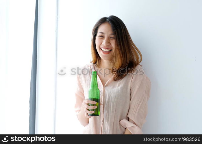 Asian women drinking beer at party, celebration, lifestyle