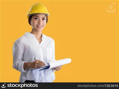 Asian women engineering inspecting and working and holding blueprints at office