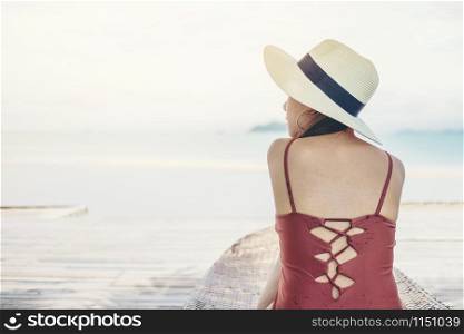 Asian women relaxing in summer holiday on beach
