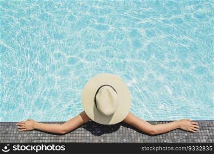 Asian women relaxing in swimming pool summer holiday on beach