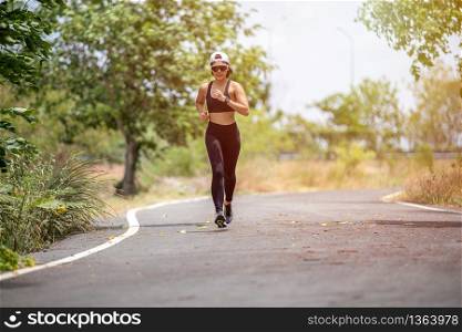 Asian women Running and jogging during outdoor on park
