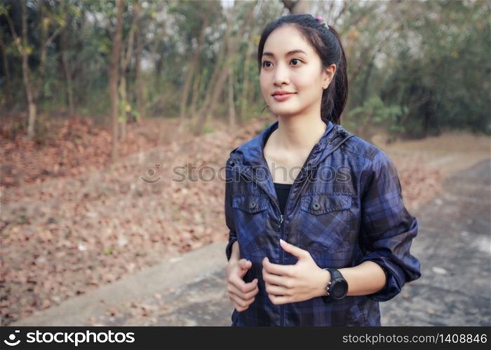 Asian women Running and jogging during outdoor on road in park