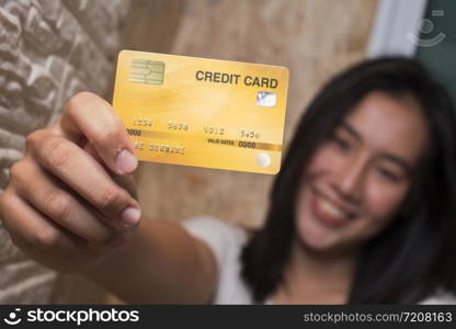 Asian women showing credit card
