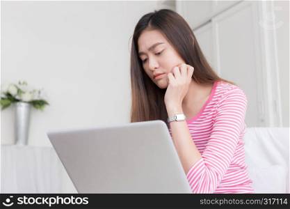 Asian women stressful working with a computer for a long time