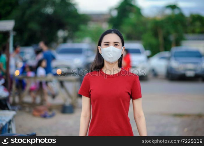 Asian women Thai people use face mask or Surgical mask protect corona virus,Covid 19,New normal life of people in Southeast Asia,Thai women use mask in walking street