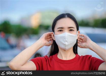 Asian women Thai people use face mask or Surgical mask protect corona virus,Covid 19,New normal life of people in Southeast Asia,Thai women use mask in walking street