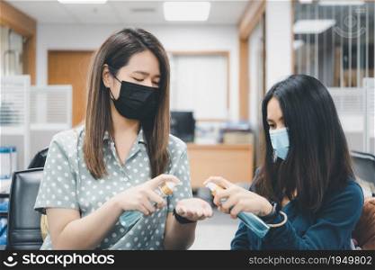 Asian women wearing mask and alcohol antibacterial hand gel respiratory protection mask against epidemic flu covid19 or corona virus with fear emotion in concept illness, outbreak, healthcare in life. Women wearing mask protection epidemic flu covid19