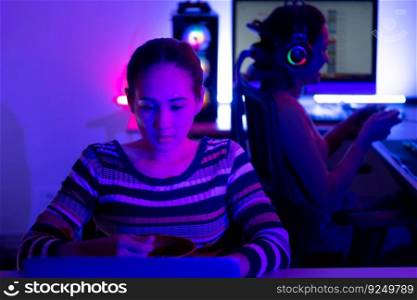 Asian women who rely heavily on computers to watch drama series until having to eat instant noodles in front of it, The game room has computers and LED neon lights that are spectacular.