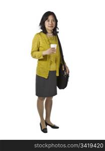 Asian women with paper coffee cup and laptop case dressed business causal on white background