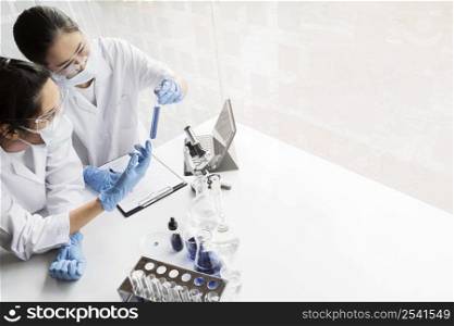 asian women working chemical project new discovery with copy space