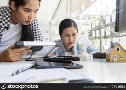 asian women working hard together
