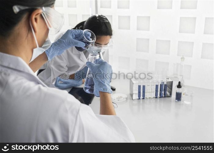 asian women working together chemical project with copy space