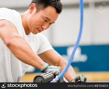 Asian worker in production plant on the factory floor. portrait of asian worker in production plant working on the factory floor