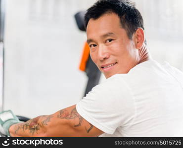 Asian worker in production plant on the factory floor. portrait of asian worker in production plant working on the factory floor