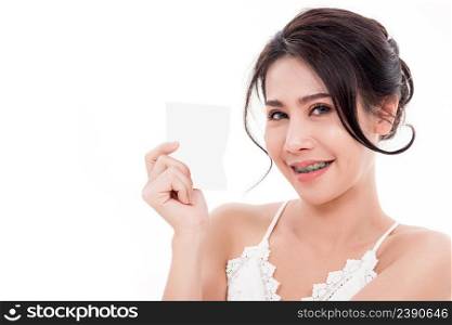 Asian young beautiful woman smiling she’s holding blank square skin care near face for present product isolated on over white background, Beauty concept