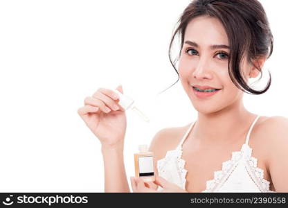 Asian young beautiful woman smiling she’s holding bottle serum hair or skin care near face for present product isolated on over white background, Beauty salon concept