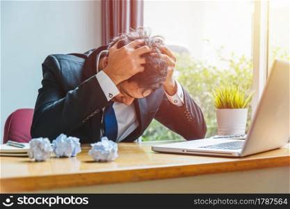 Asian young business man tired strain failure on he work in desk table office