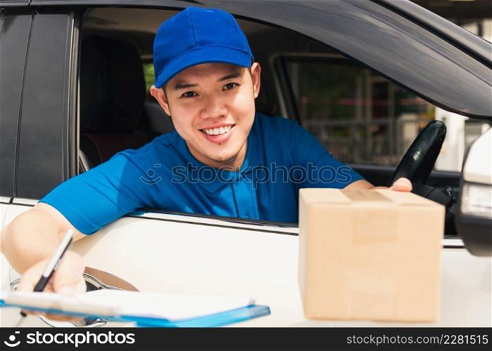 Asian young delivery man courier wear uniform in the car hold documents clipboard hand over to customer to signing signature for receipt of delivery package at door front house