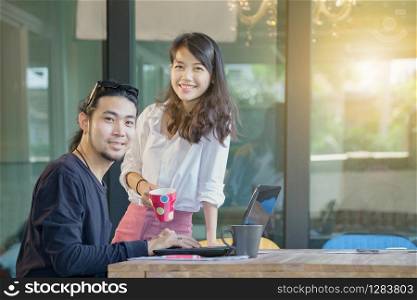 asian younger freelance man and woman happiness emotion working at home