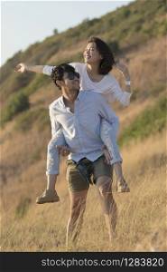 asian younger man and woman relaxing happiness emotion on traveling destination
