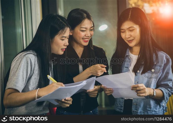 asian younger woman freelance talking with toothy smiling face in home office