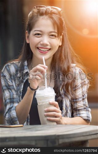asian younger woman toothy smiling face happiness drinking cool beverage
