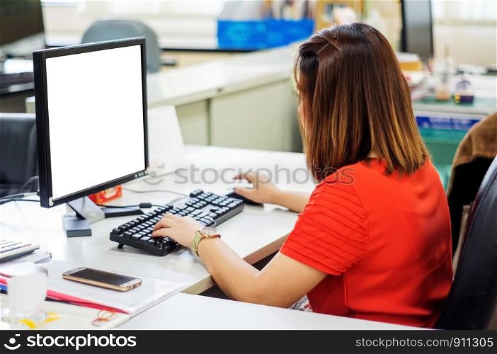 Asians women working at computer in an office.
