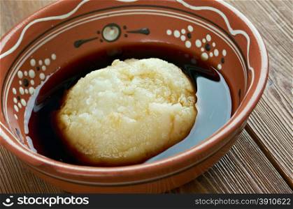 Asida - cooked wheat flour lump of dough.popular in Algeria, Libya, Tunisia, Saudi Arabia, Eritrea, Ethiopia, Sudan, and Yemen.