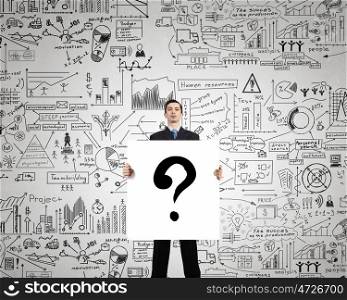 Ask your question. Businessman holding banner with drawn money earning concept