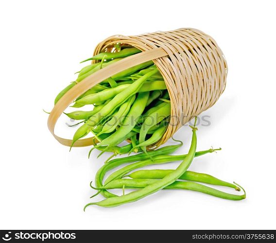 Asparagus green beans in a wicker basket isolated on white background