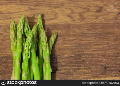 Asparagus on a wooden background 
