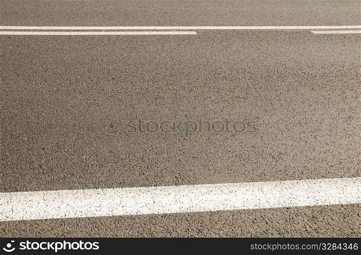 Asphalt background texture with some soft shades on it