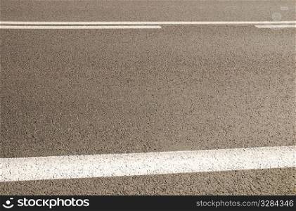 Asphalt background texture with some soft shades on it