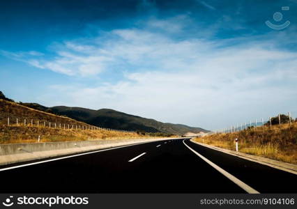 asphalt blue sky clouds