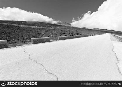 Asphalt Road between the Black Lava Covered Slopes of Mount Etna in Sicily, Retro Image Filtered Style