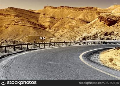 Asphalt Road in the Negev Desert in Israel, Vintage Style Toned Picture