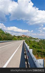 Asphalt Road Leading to the Medieval Italian City of Prato