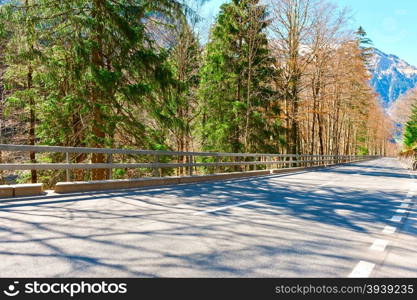 Asphalt Road on the Background of Snow-capped Alps in Switzerland