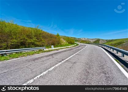 Asphalt Road on the Slopes of the Apennine Mountains in Italy