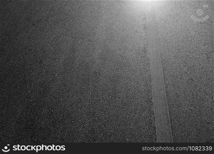 Asphalt road with marking lines white stripes texture Background.
