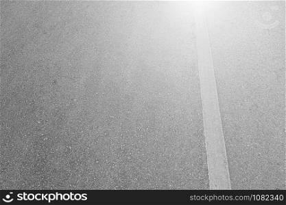 Asphalt road with marking lines white stripes texture Background.