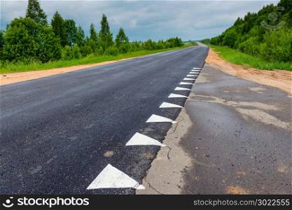 asphalted country road, intersection of two roads