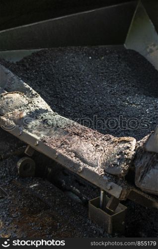Asphalting machine on the road. Close up